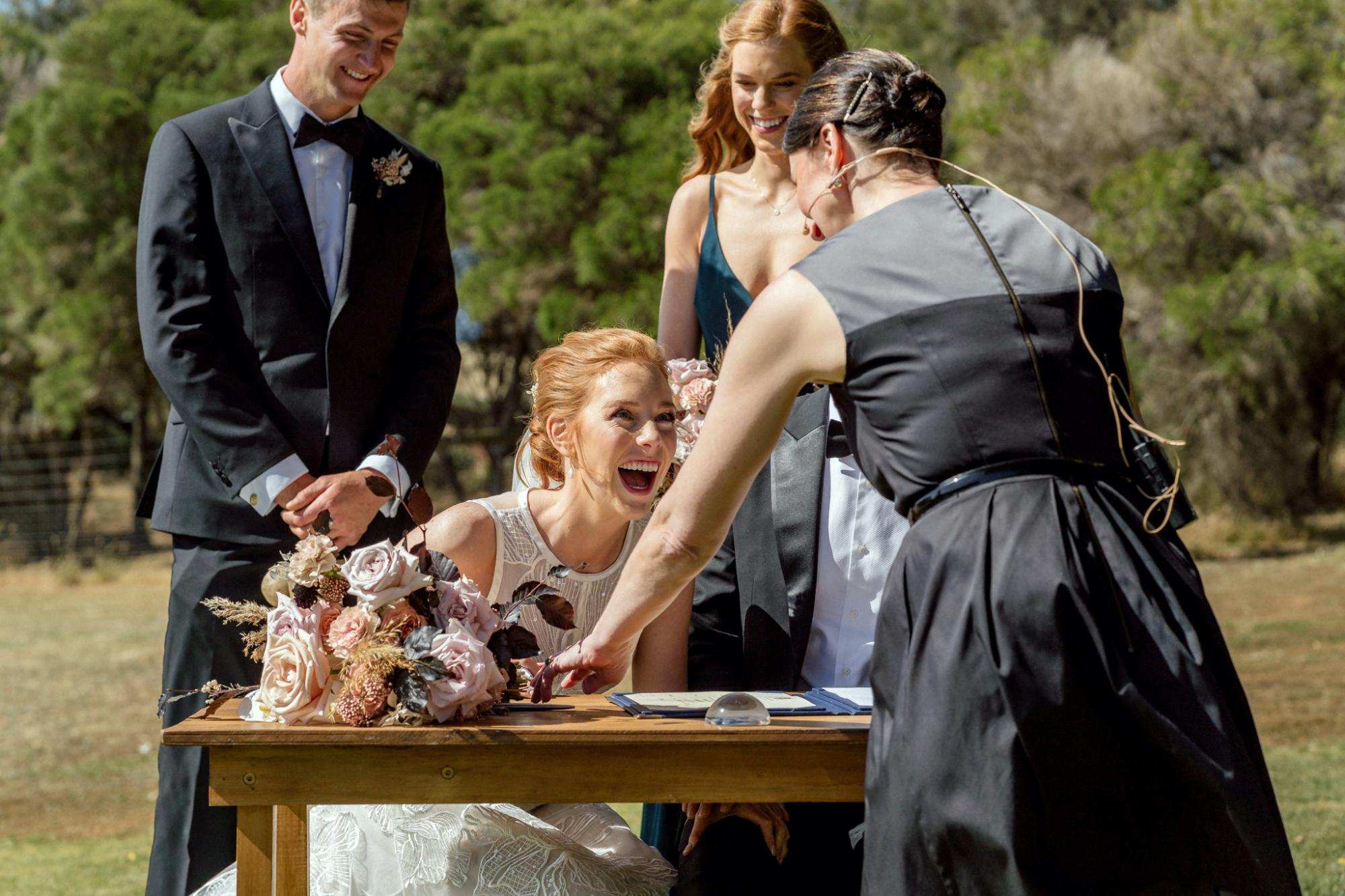 Signing the marriage register with Melbourne Celebrant Meriki Comito