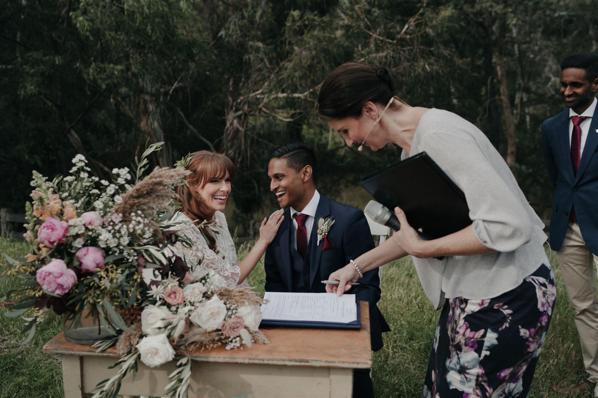 Signing the marriage register with Melbourne Celebrant Meriki Comito