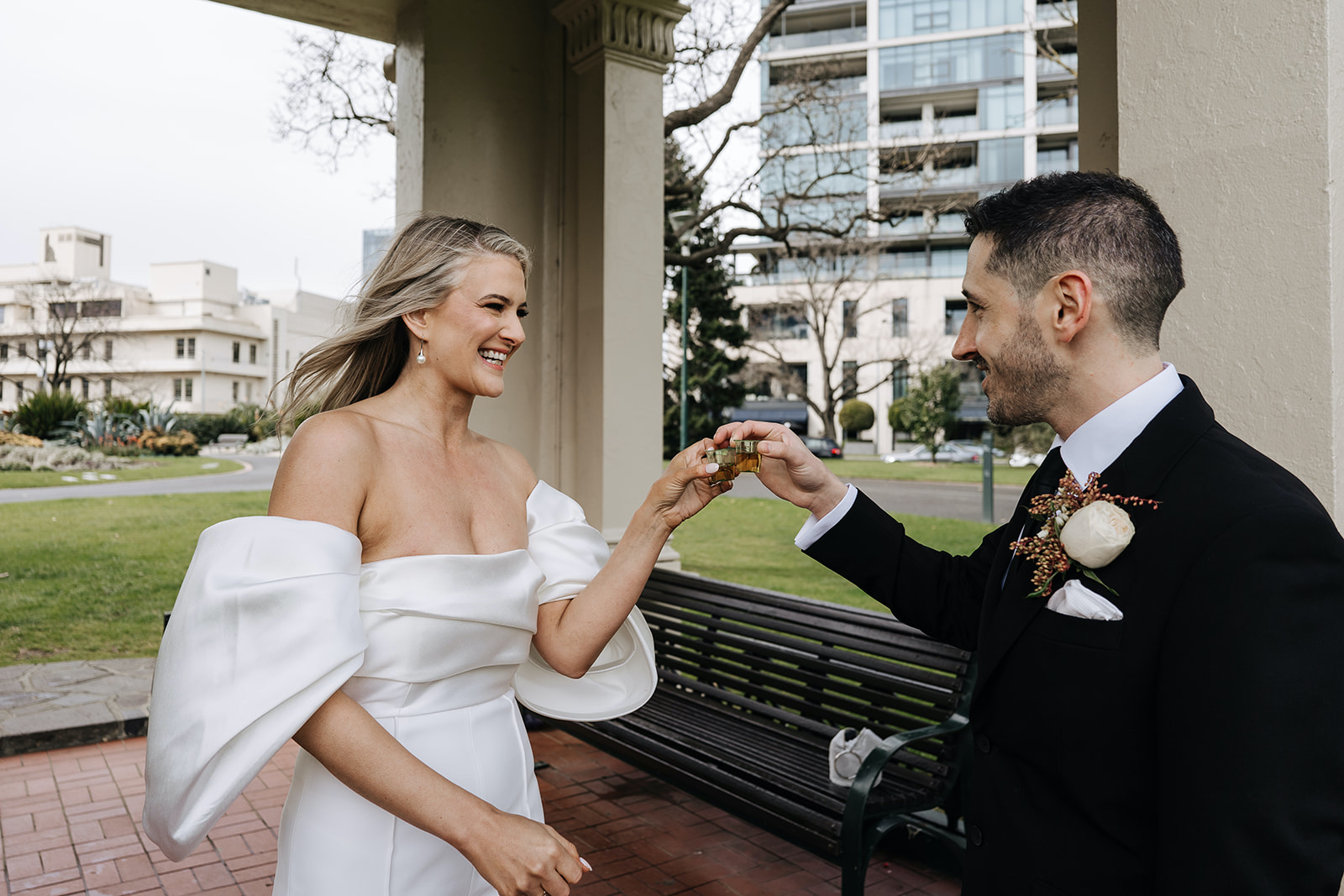 Wedding planning with Intention Bride + groom toasting their garden marriage with a shot of whiskey